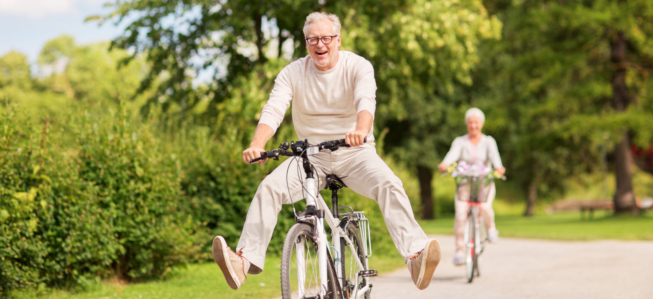 A man on a bike is pleased with his smile thanks to the benefits of single tooth dental implants